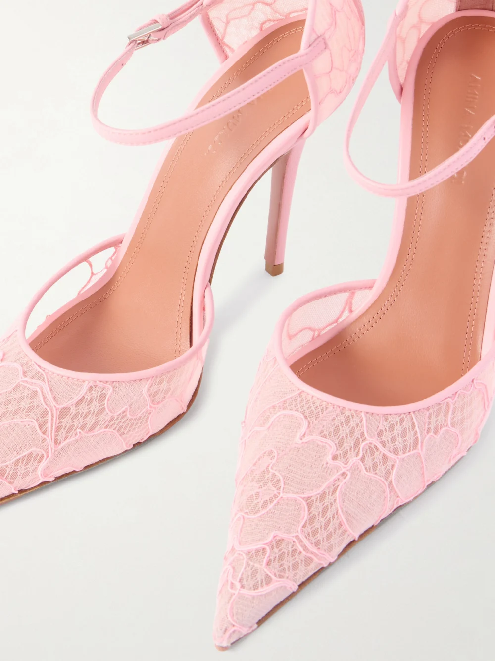 Close-up detail of the Amina Muaddi Barbara Leather-trimmed Lace Pumps