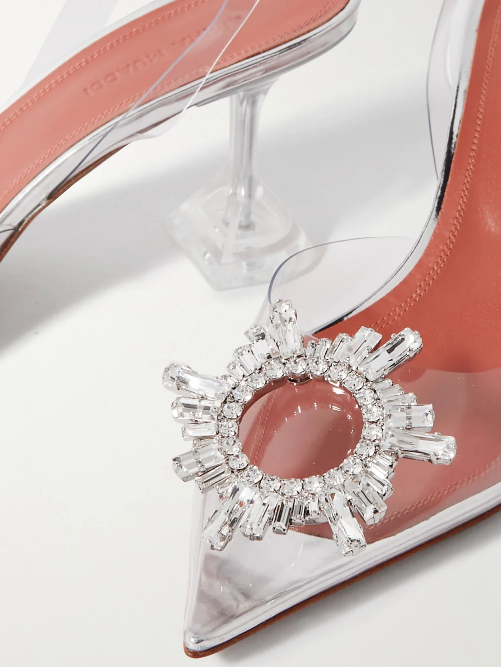 Close-up detail of the Amina Muaddi Begum Crystal-embellished Pvc Slingback Pumps