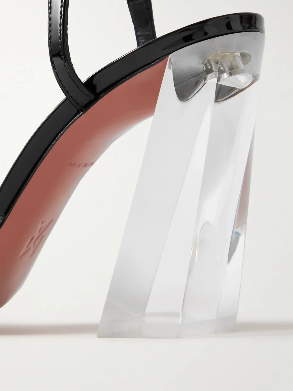 Close-up detail of the Amina Muaddi Charlotte 95 Pvc and Patent-leather Slingback Pumps
