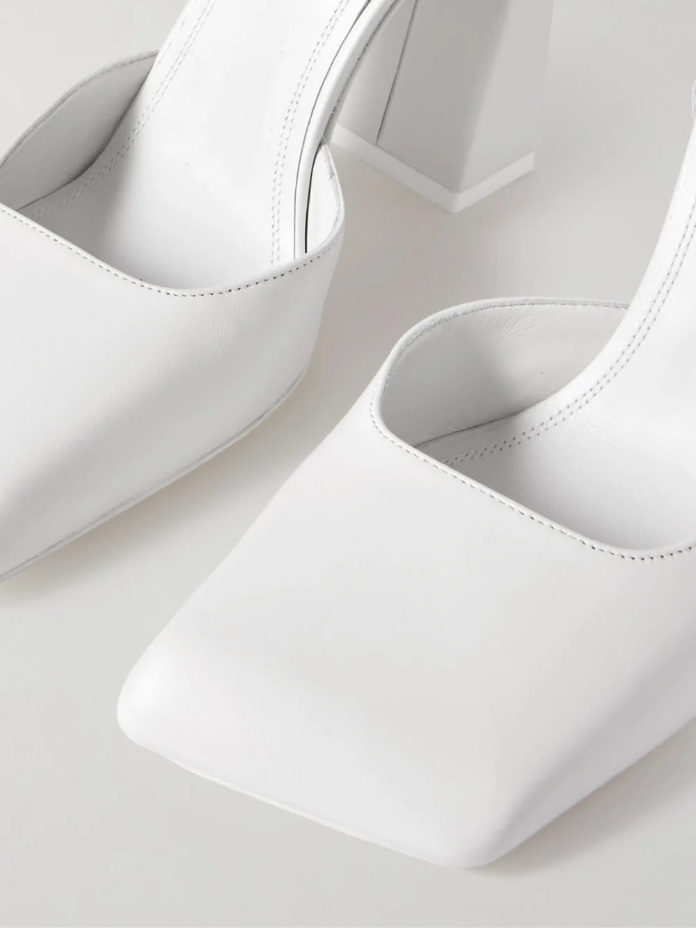 Close-up detail of the Amina Muaddi Charlotte Leather Pumps