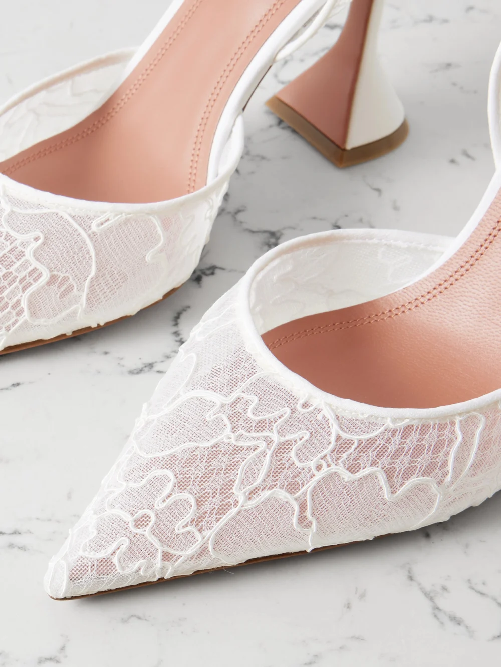 Close-up detail of the Amina Muaddi Holli 95 Lace and Leather Slingback Pumps