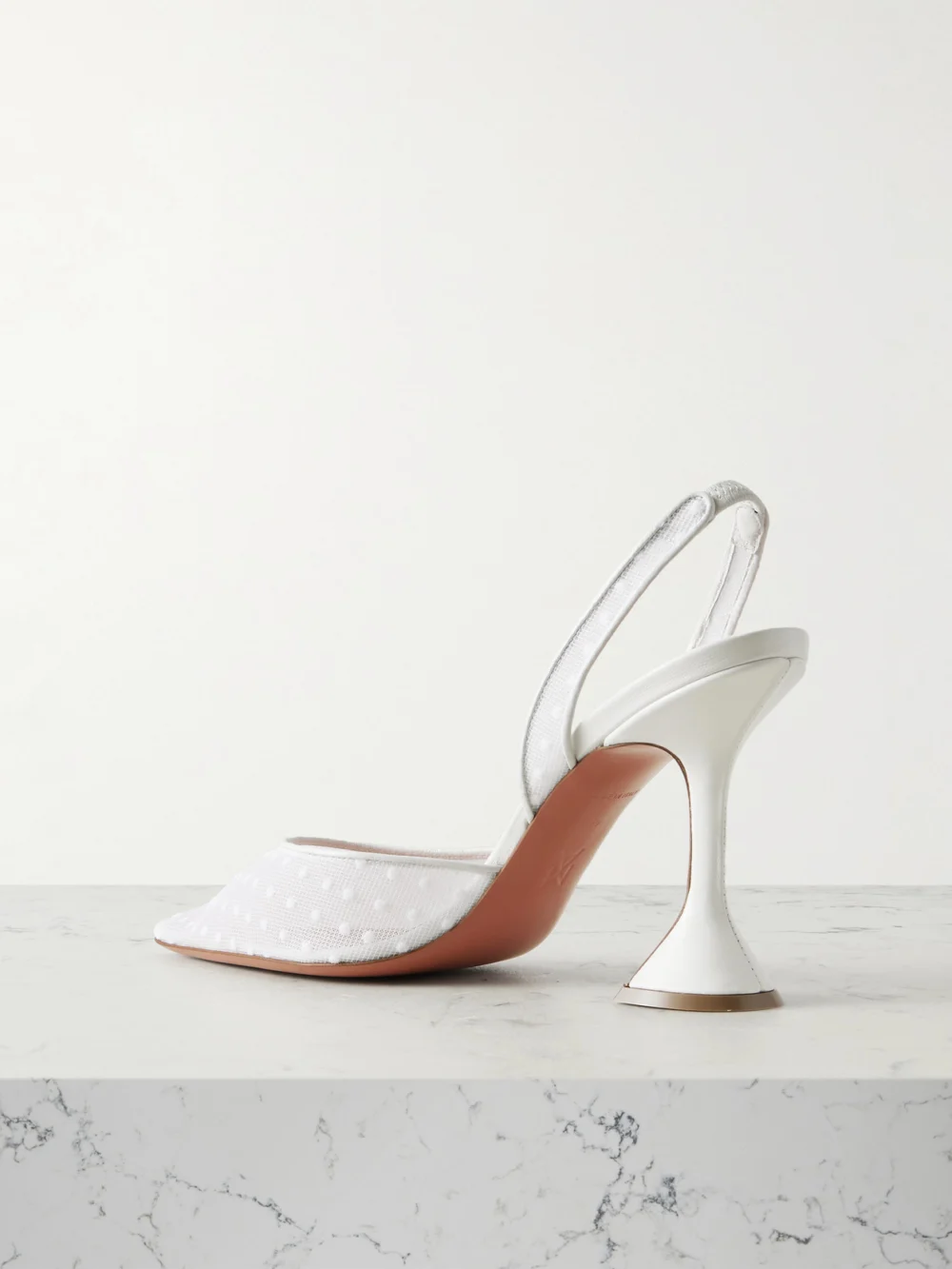 Back view of the Amina Muaddi Holli Leather-trimmed Flocked Polka-dot Mesh Slingback Pumps