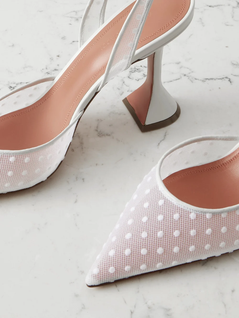 Close-up detail of the Amina Muaddi Holli Leather-trimmed Flocked Polka-dot Mesh Slingback Pumps