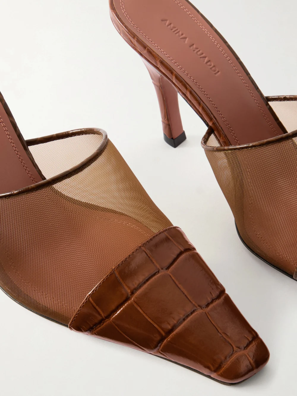 Close-up detail of the Amina Muaddi Jamie Mesh and Croco-embossed Leather Mules