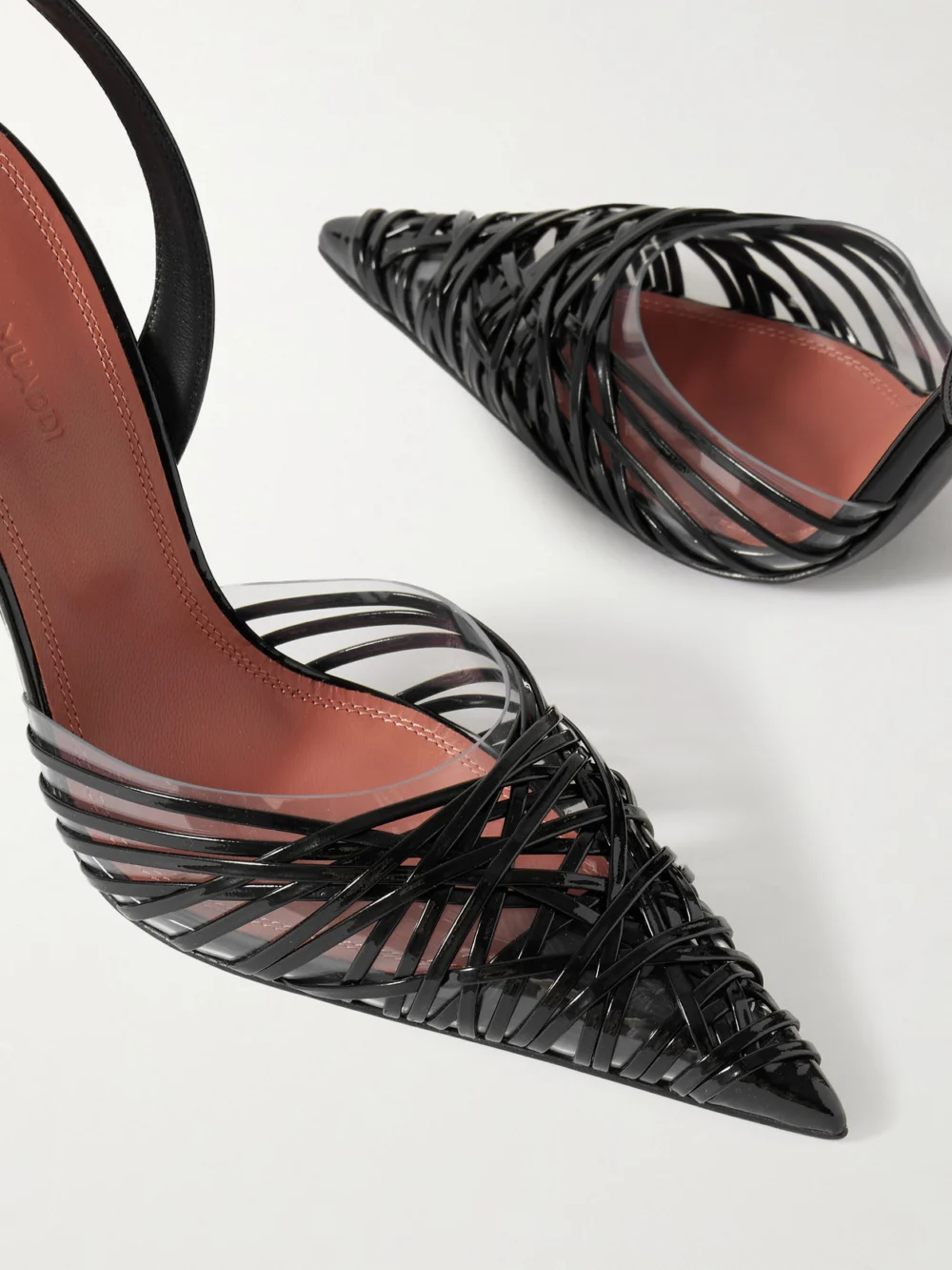 Close-up detail of the Amina Muaddi Lori Sling Patent-leather and Pvc Slingback Pumps