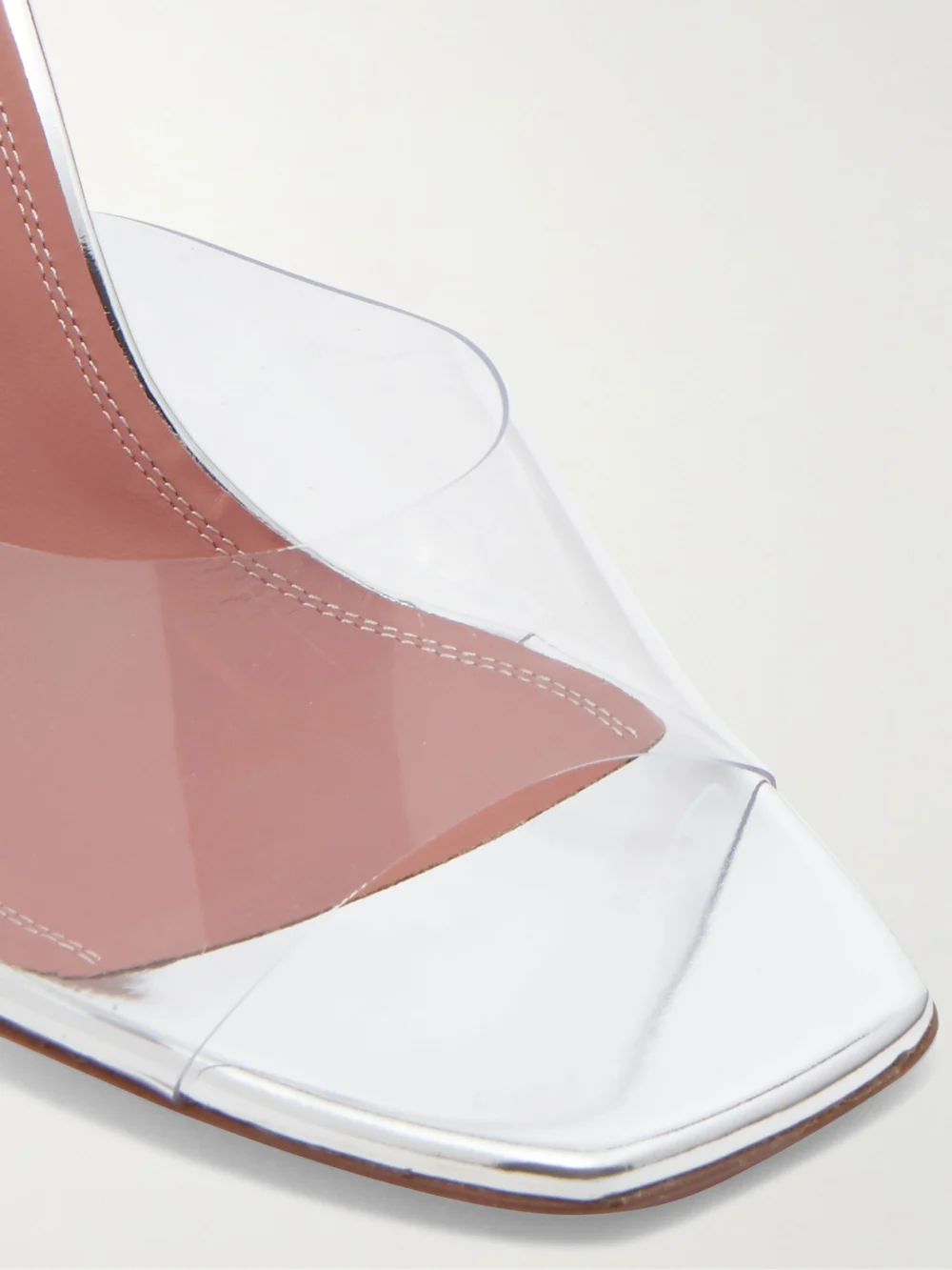 Close-up detail of the Amina Muaddi Lupita 95 Pvc and Leather Mules