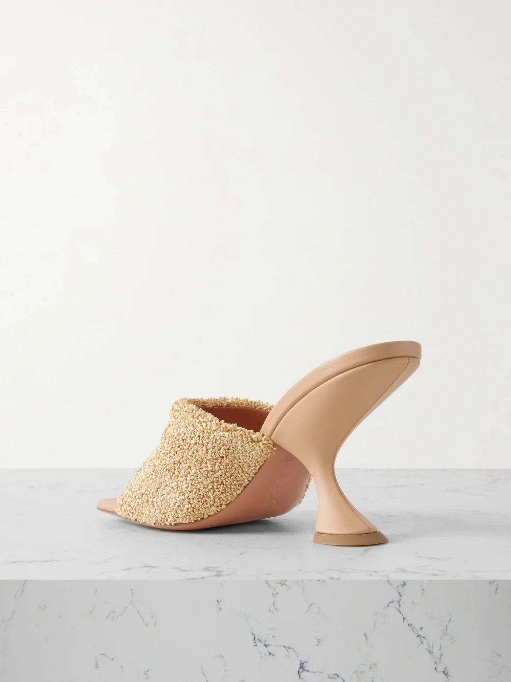 Back view of the Amina Muaddi Taylor Leather-trimmed Raffia Mules