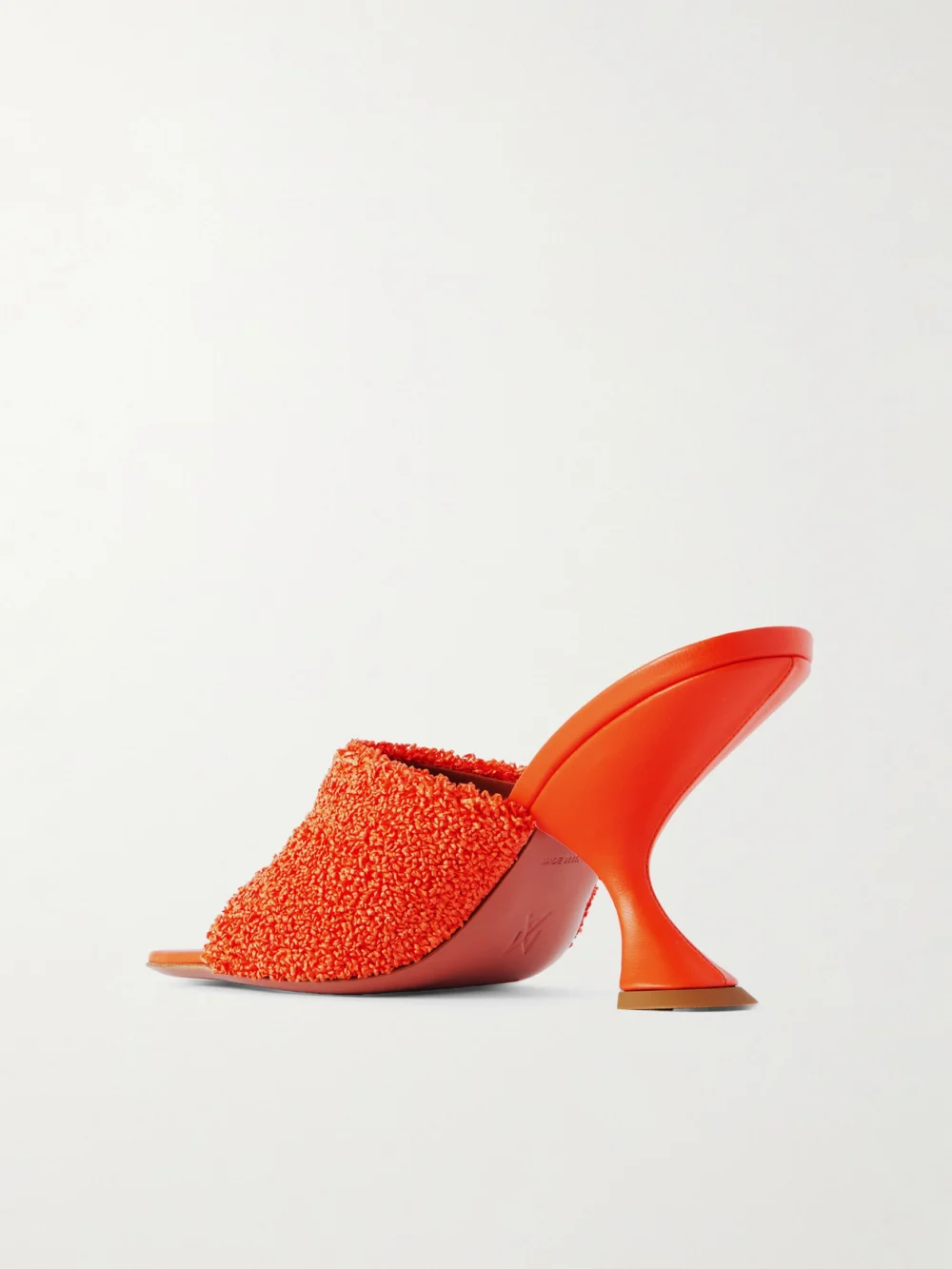 Back view of the Amina Muaddi Taylor Leather-trimmed Raffia Mules