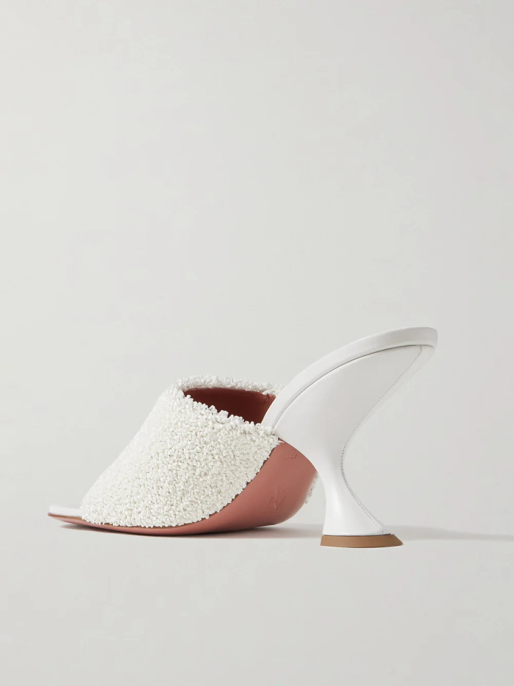 Back view of the Amina Muaddi Taylor Leather-trimmed Raffia Mules