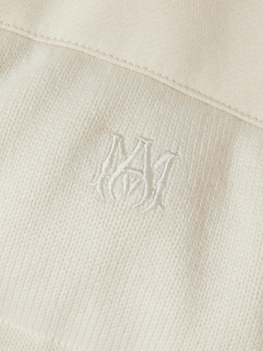 Close-up detail of the Amiri Quilted Cotton-jersey and Cashmere Down Jacket