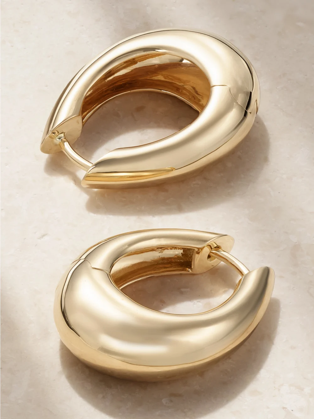 Close-up detail of the Ananya Chakra Icon 18-karat Gold Hoop Earrings