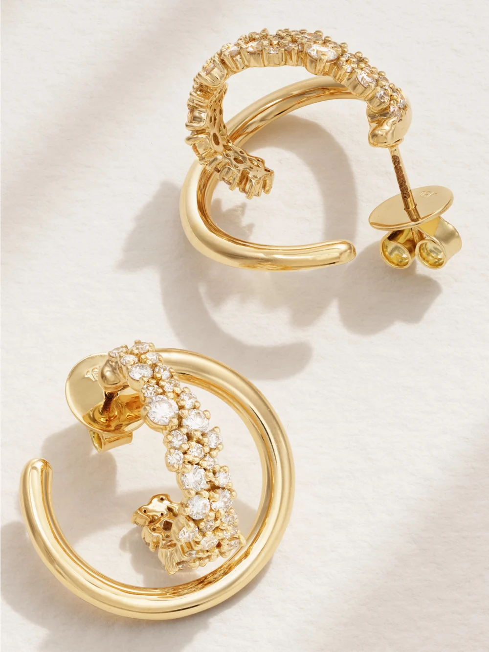 Close-up detail of the Ananya Scatter Mini 18-karat Gold Diamond Hoop Earrings