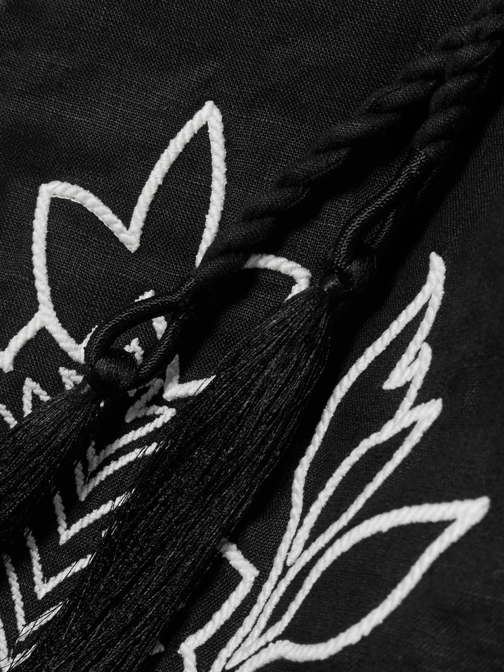 Close-up detail of the Andres Otalora Haath Tasseled Embroidered Linen Mini Dress