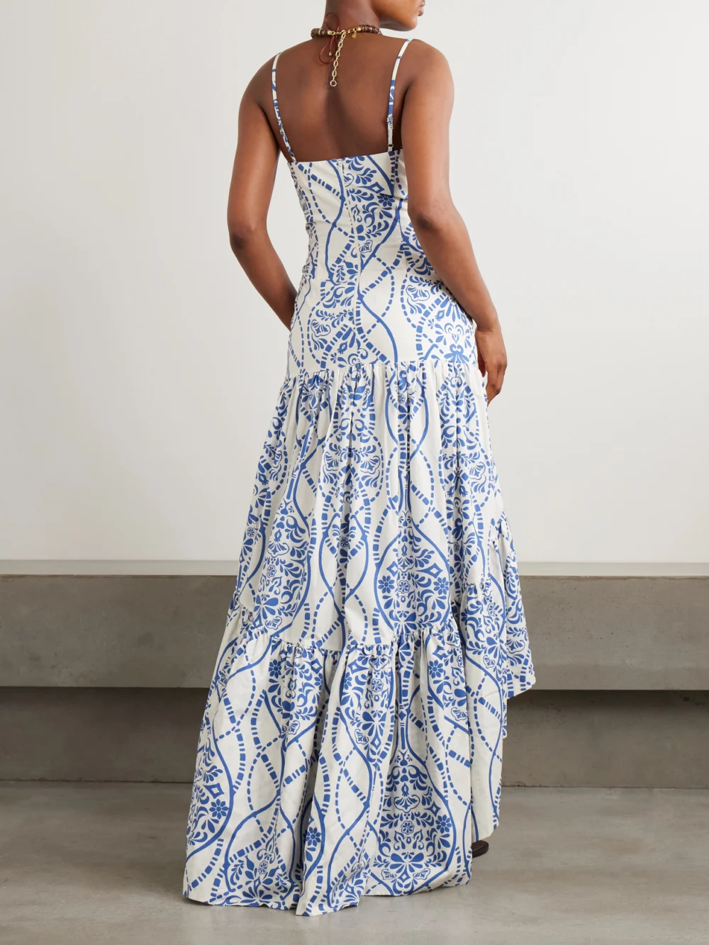 Back view of the Andres Otalora Joyah Colonial Printed Tiered Asymmetric Maxi Dress