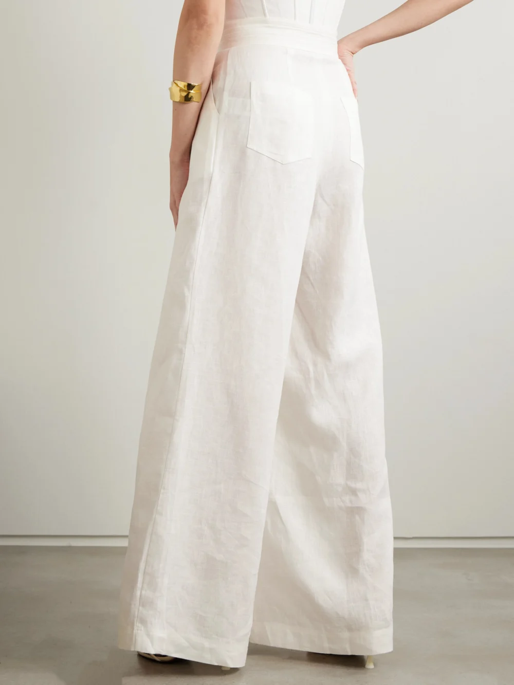 Back view of the Andres Otalora Kushi Pleated Linen Wide-leg Pants