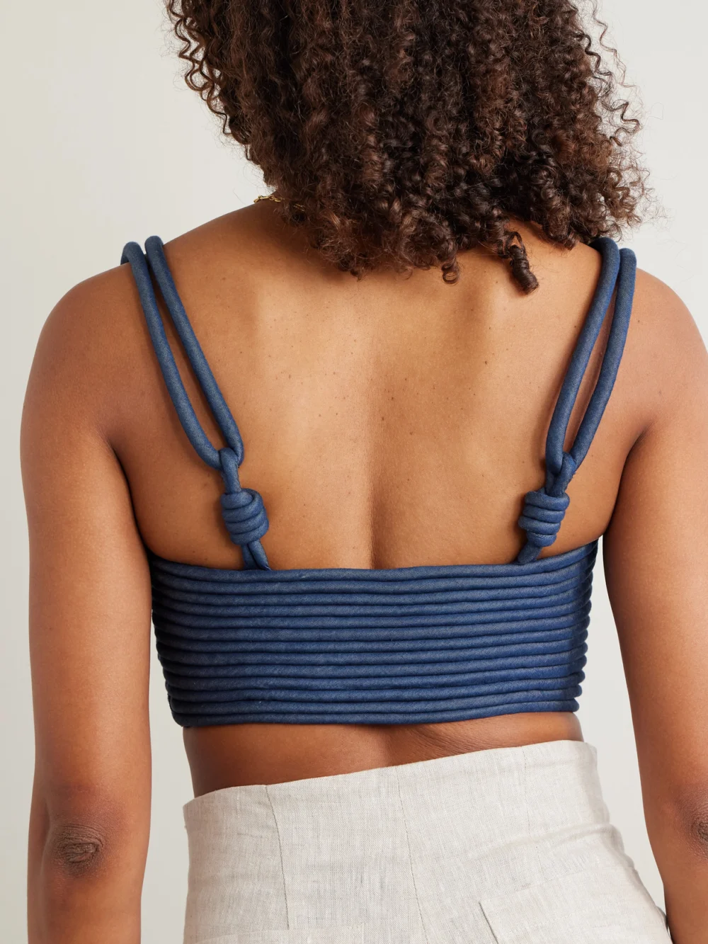 Back view of the Andres Otalora Redes Cropped Corded Chambray Top