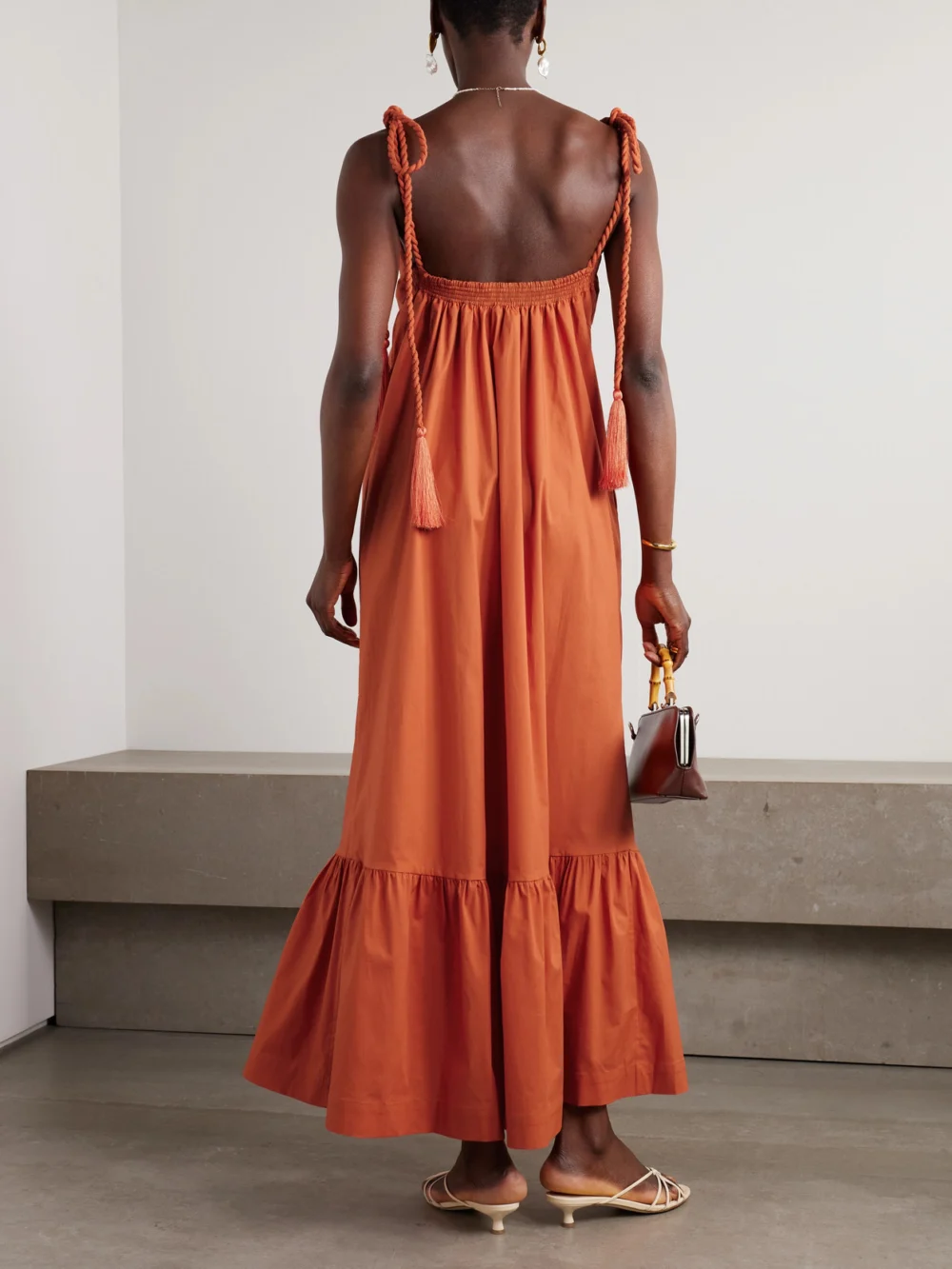 Back view of the Andres Otalora Tasseled Ruffled Cotton-poplin Maxi Dress