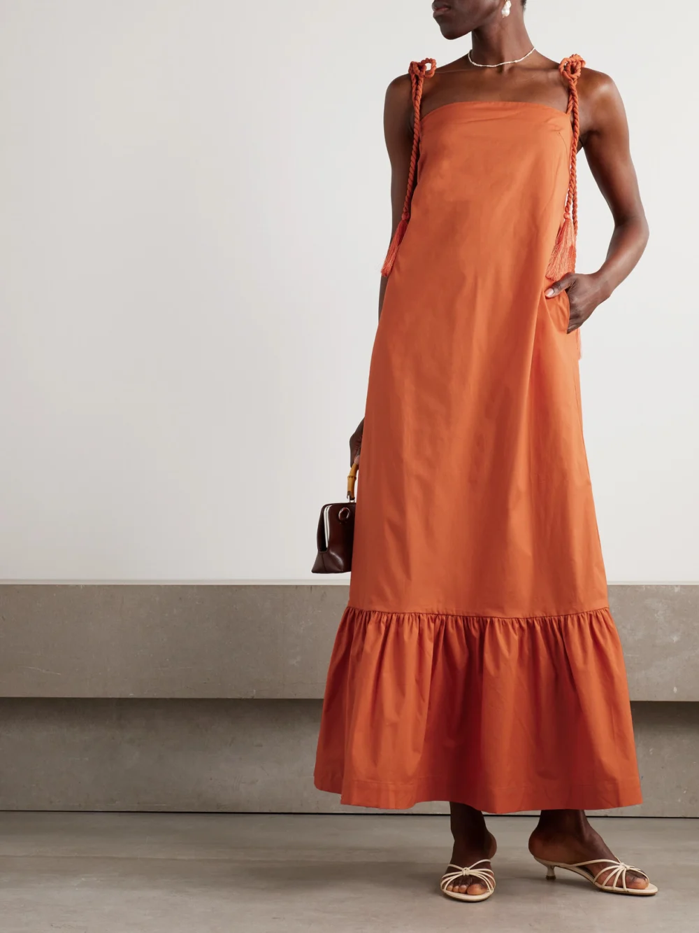 Andres Otalora Tasseled Ruffled Cotton-poplin Maxi Dress, worn by a model