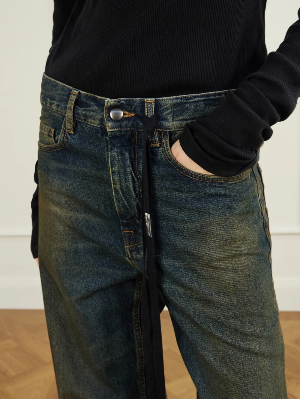 Close-up detail of the Ann Demeulemeester Genoveva Mid-rise Wide-leg Jeans