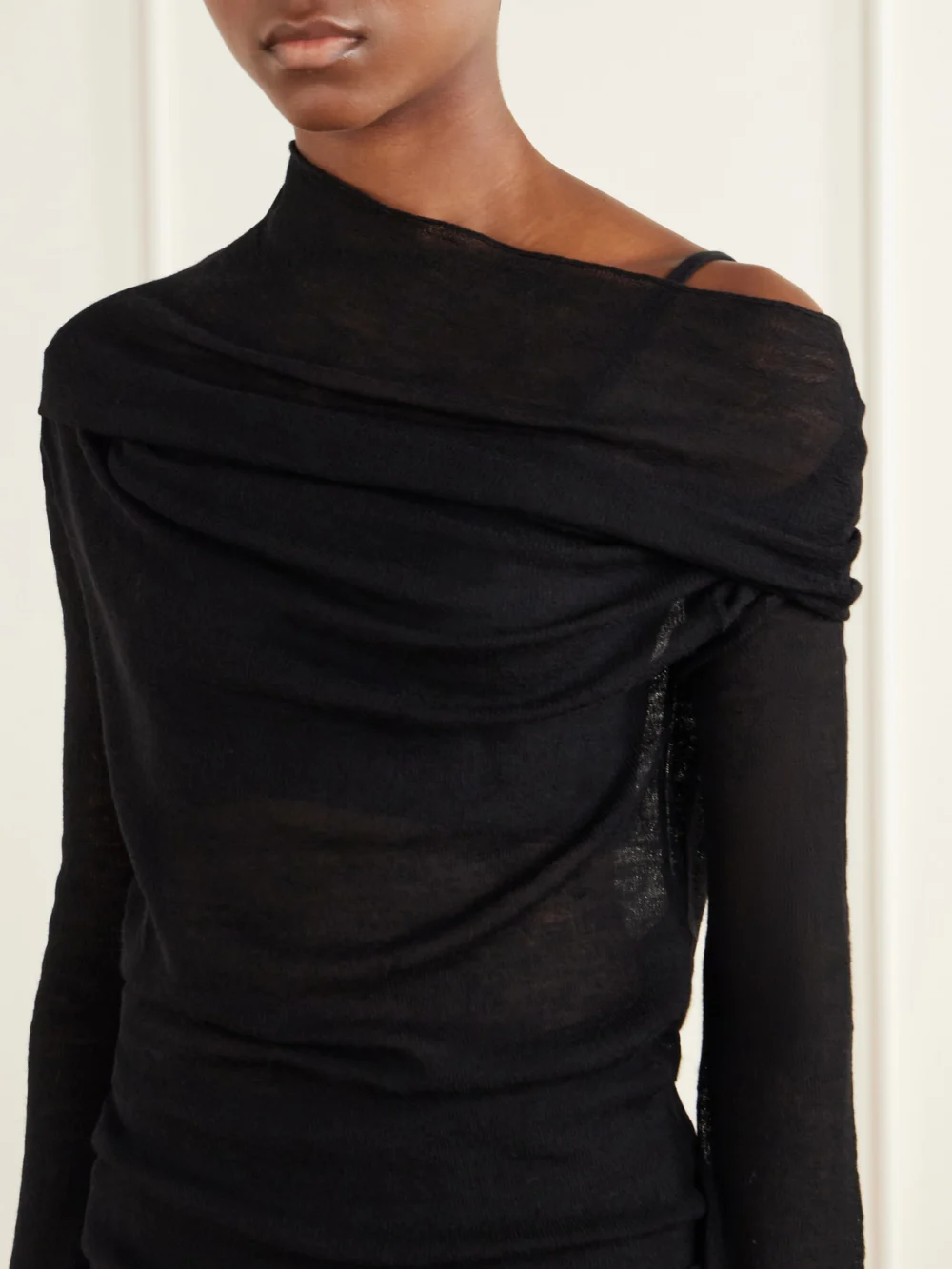 Close-up detail of the Ann Demeulemeester Tizziana Off-the-shoulder Wool Blouse