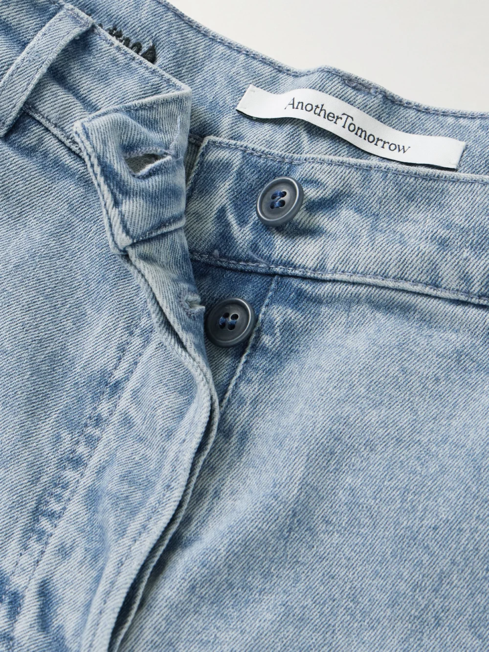 Close-up detail of the Another Tomorrow Mid-rise Straight-leg Organic Jeans