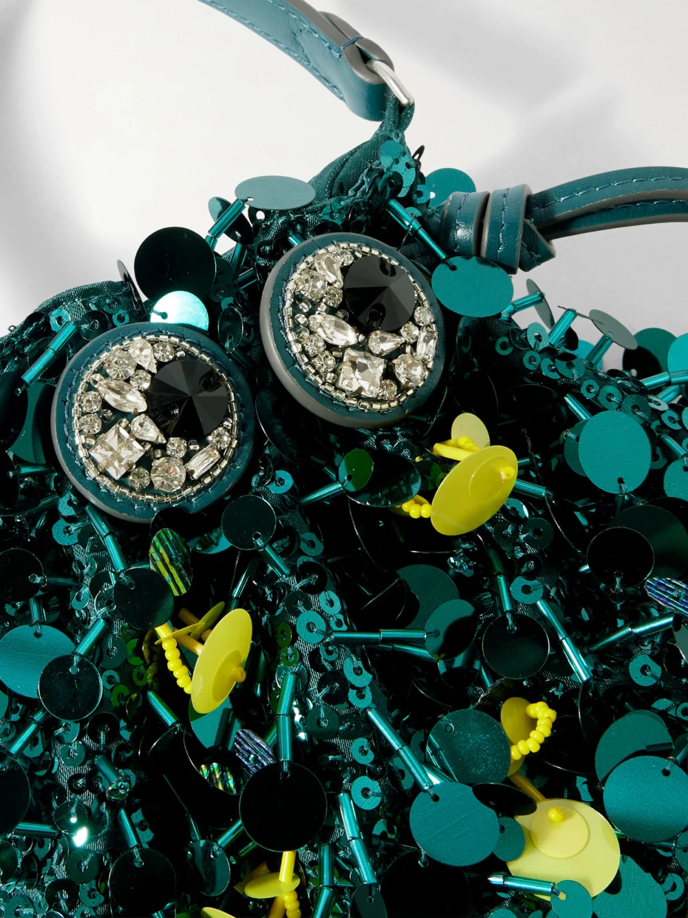 Close-up detail of the Anya Hindmarch Beetle Embellished Leather-trimmed Clutch