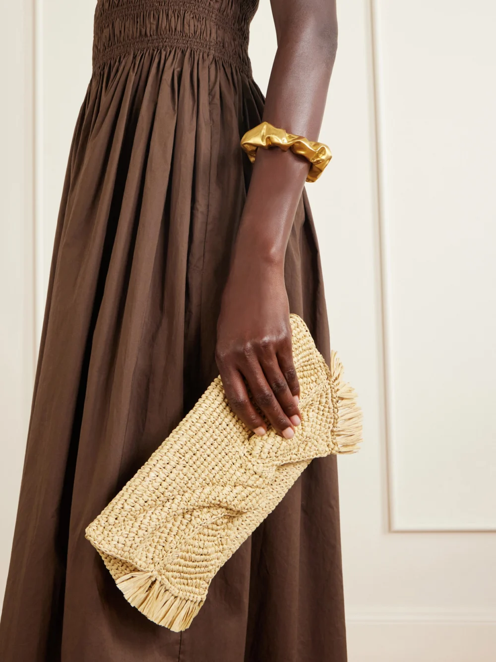 Anya Hindmarch Bow Leather-trimmed Raffia Clutch, styled view