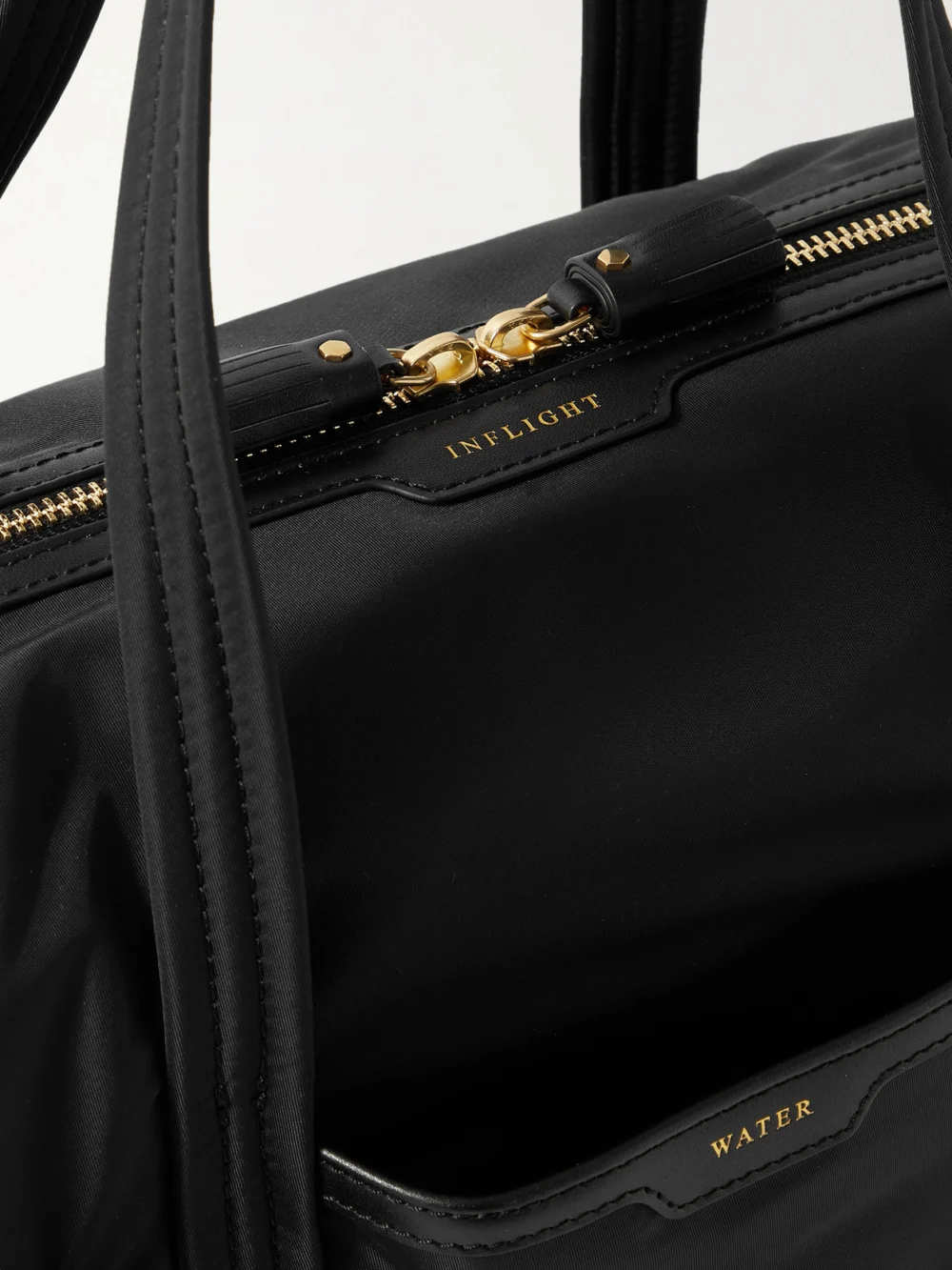 Close-up detail of the Anya Hindmarch Inflight Leather-trimmed Econyl Weekend Bag