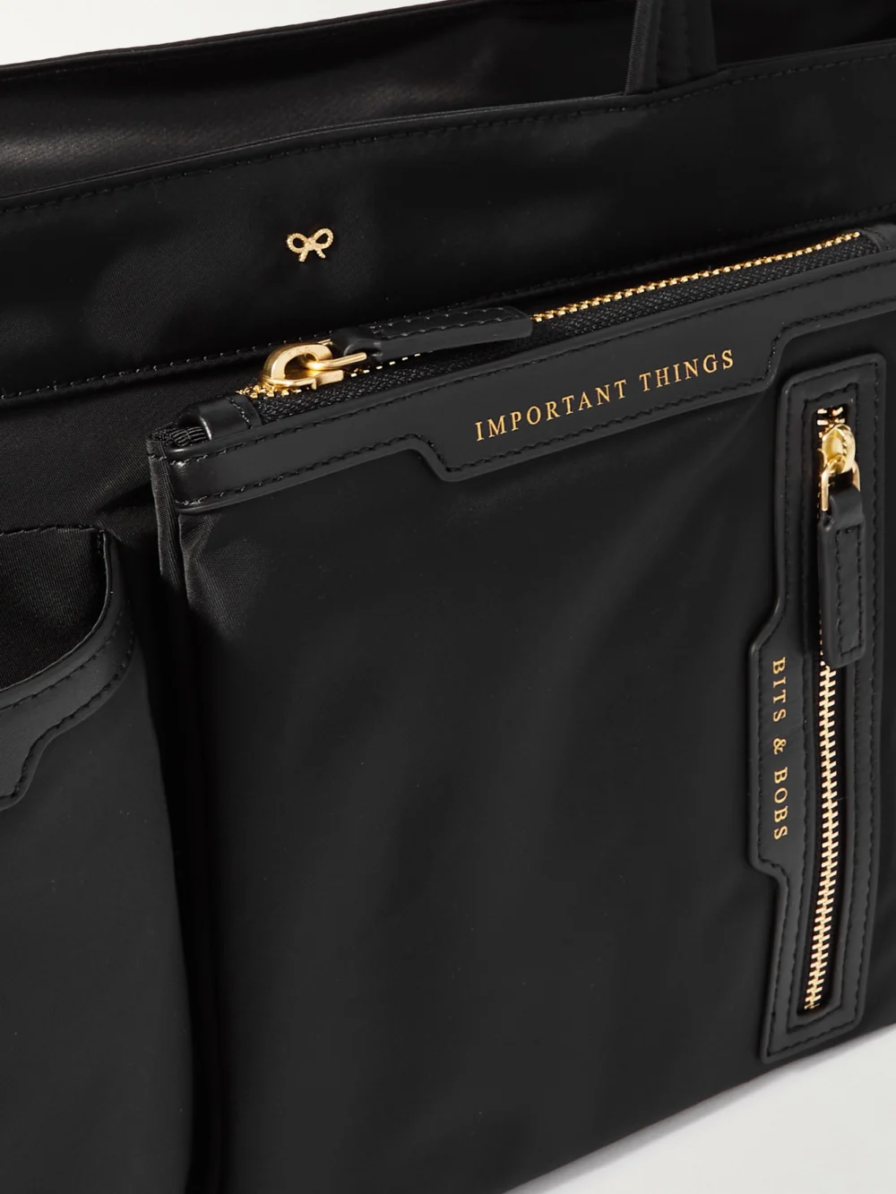Close-up detail of the Anya Hindmarch Leather-trimmed Econyl® Tote Bag