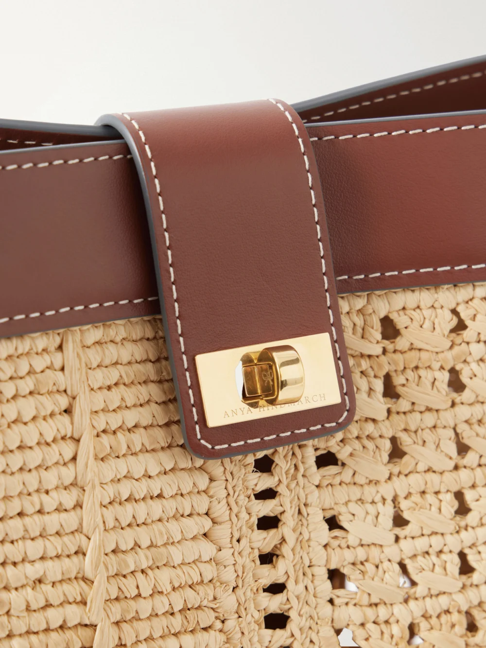 Close-up detail of the Anya Hindmarch Leather-trimmed Raffia Crossbody Bag
