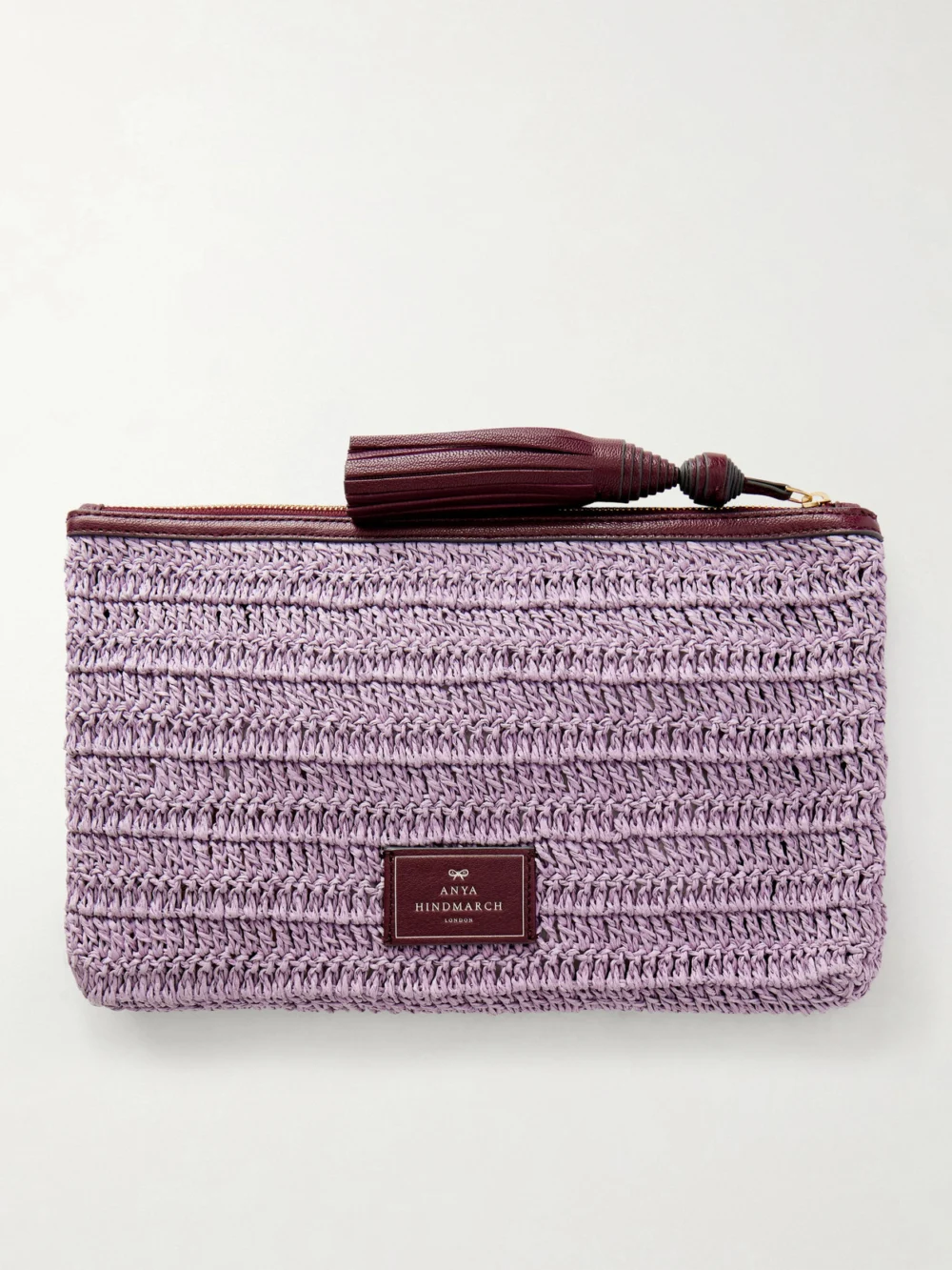 Back view of the Anya Hindmarch Wink Tasseled Leather-trimmed Raffia Clutch Bag