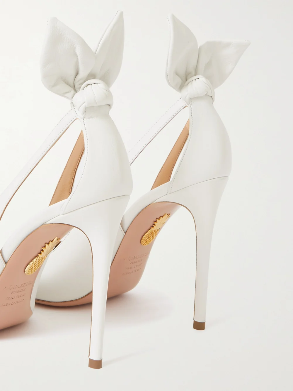 Close-up detail of the Aquazzura Bow Tie 105 Cutout Leather Pumps