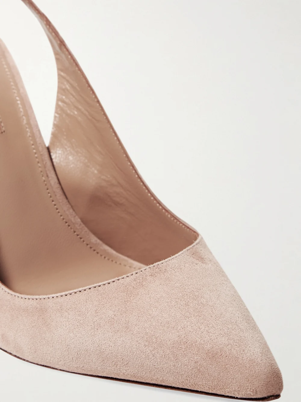 Close-up detail of the Aquazzura Bow Tie 105 Suede Pumps