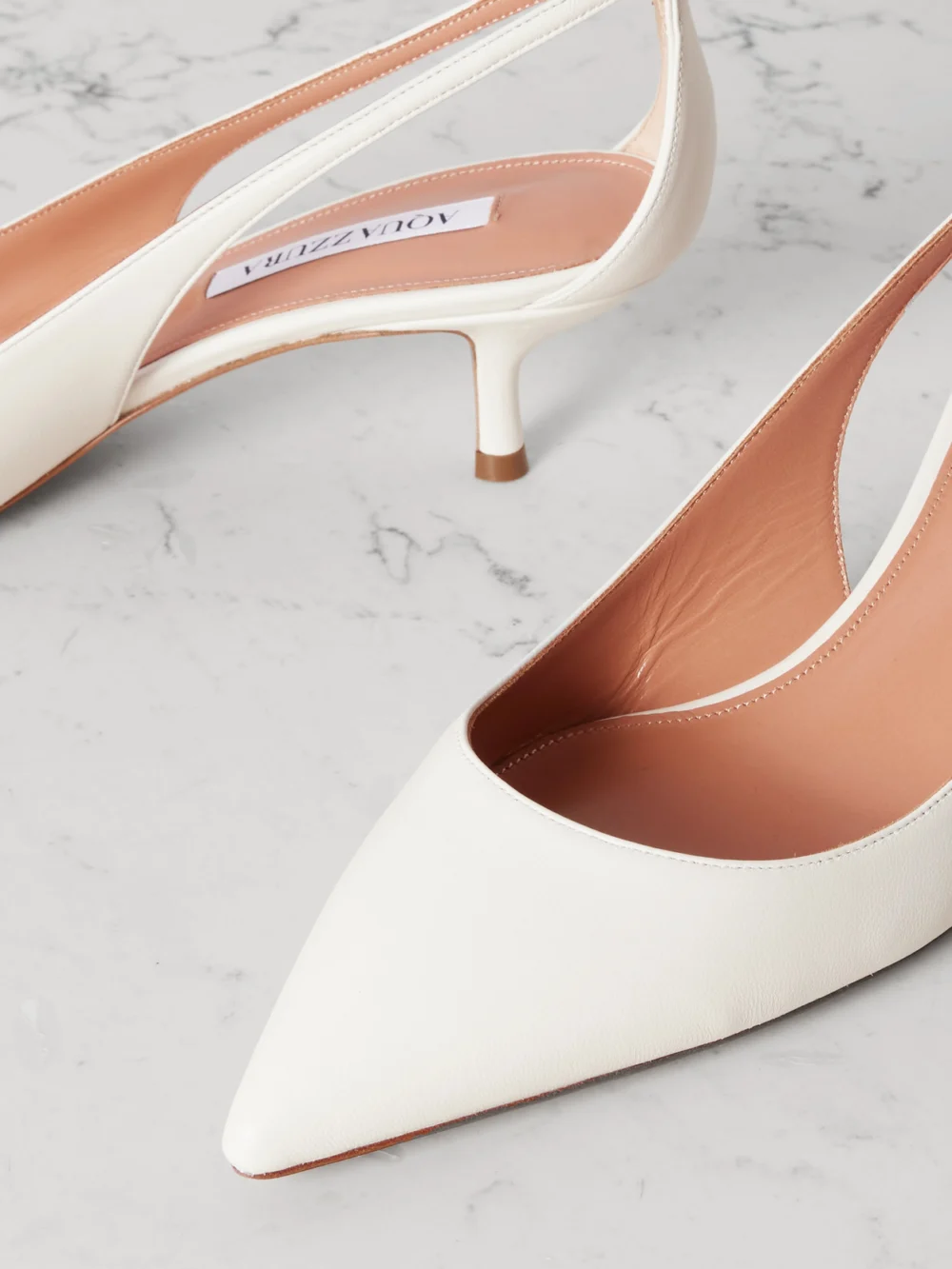 Close-up detail of the Aquazzura Bow Tie 50 Leather Pumps
