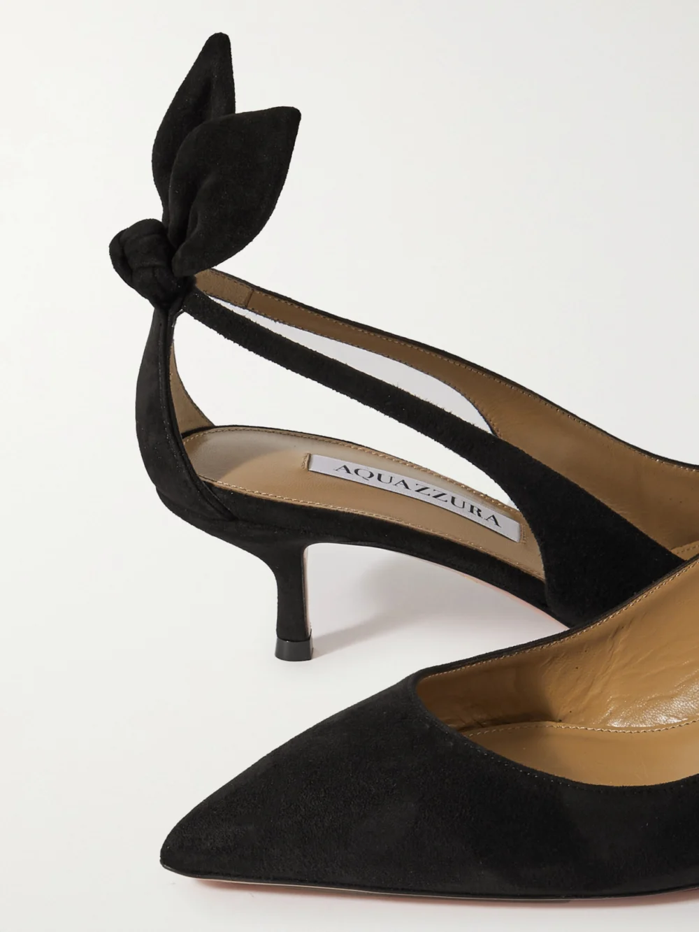 Close-up detail of the Aquazzura Bow Tie 50 Suede Pumps