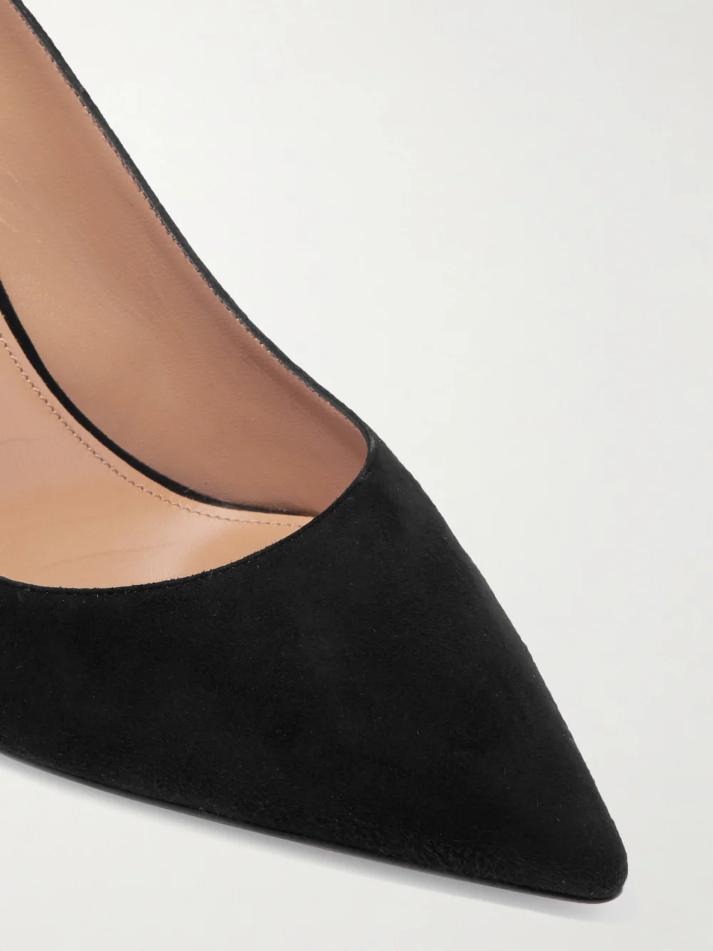 Close-up detail of the Aquazzura Bow Tie 85 Suede Pumps