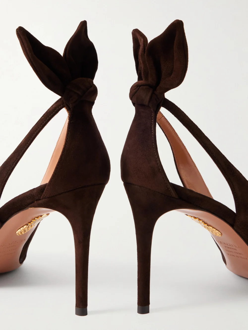 Close-up detail of the Aquazzura Bow Tie 85 Suede Pumps
