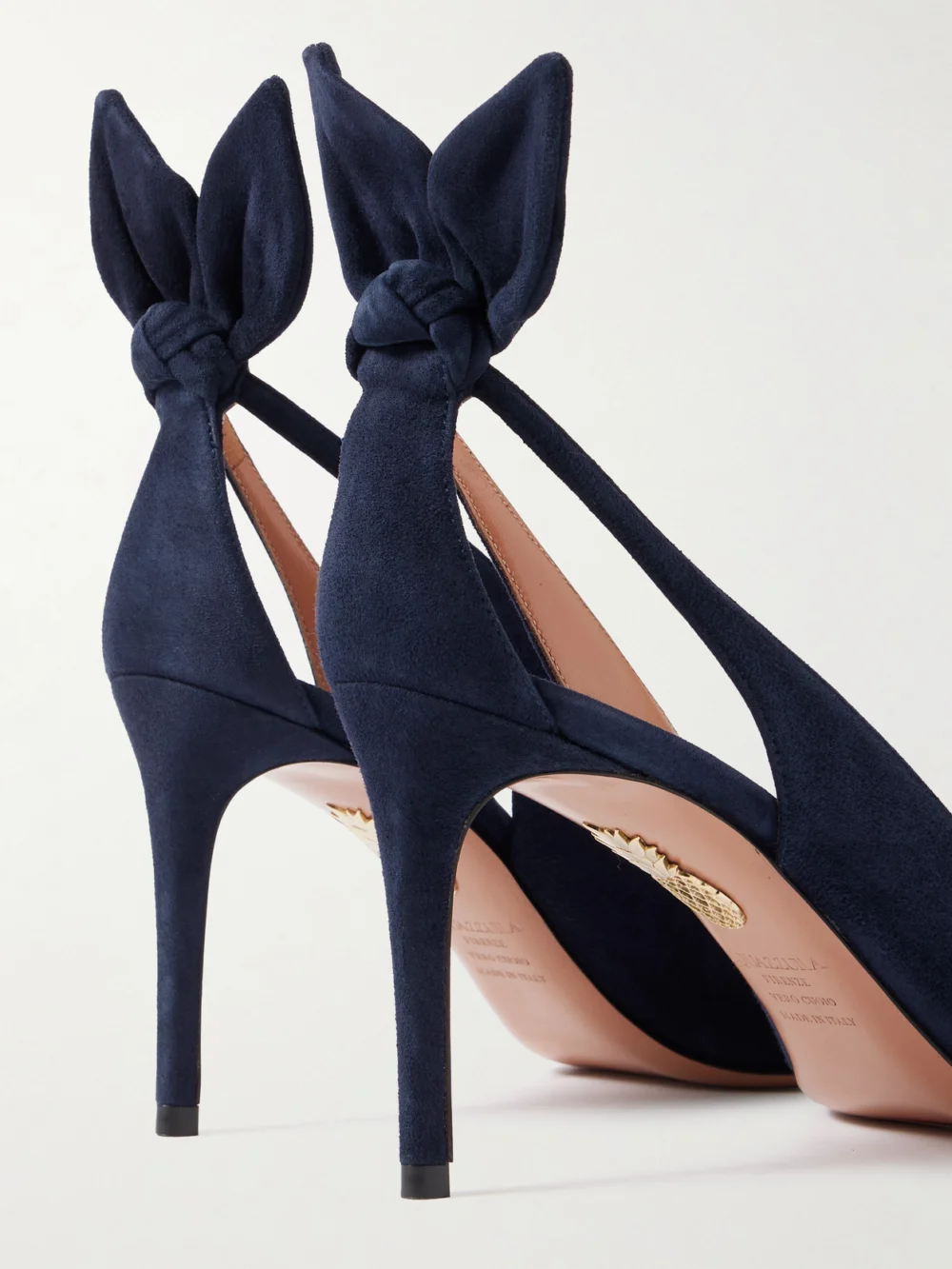 Close-up detail of the Aquazzura Bow Tie 85 Suede Pumps