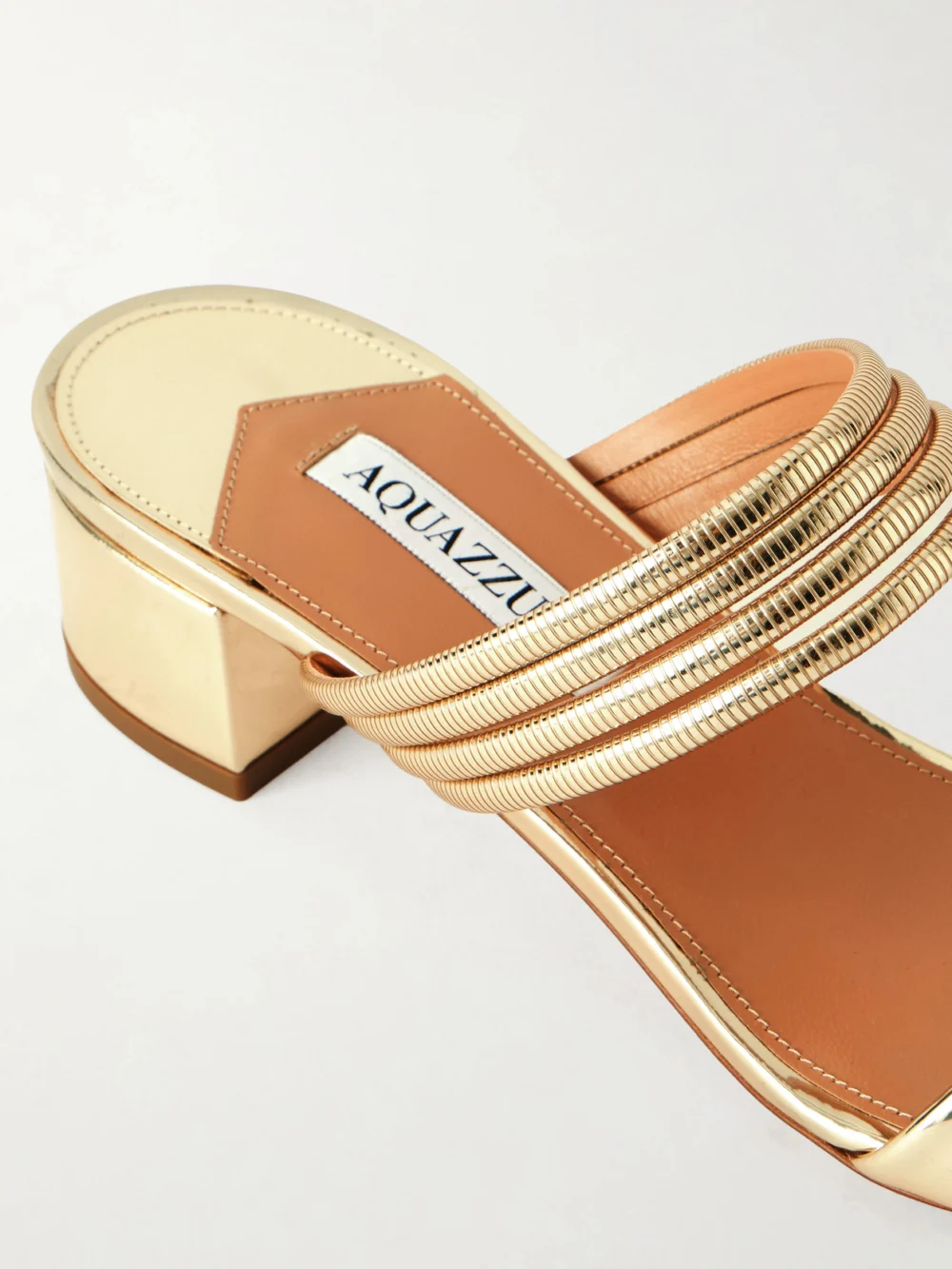 Close-up detail of the Aquazzura Collier 35 Embellished Metallic Leather Mule