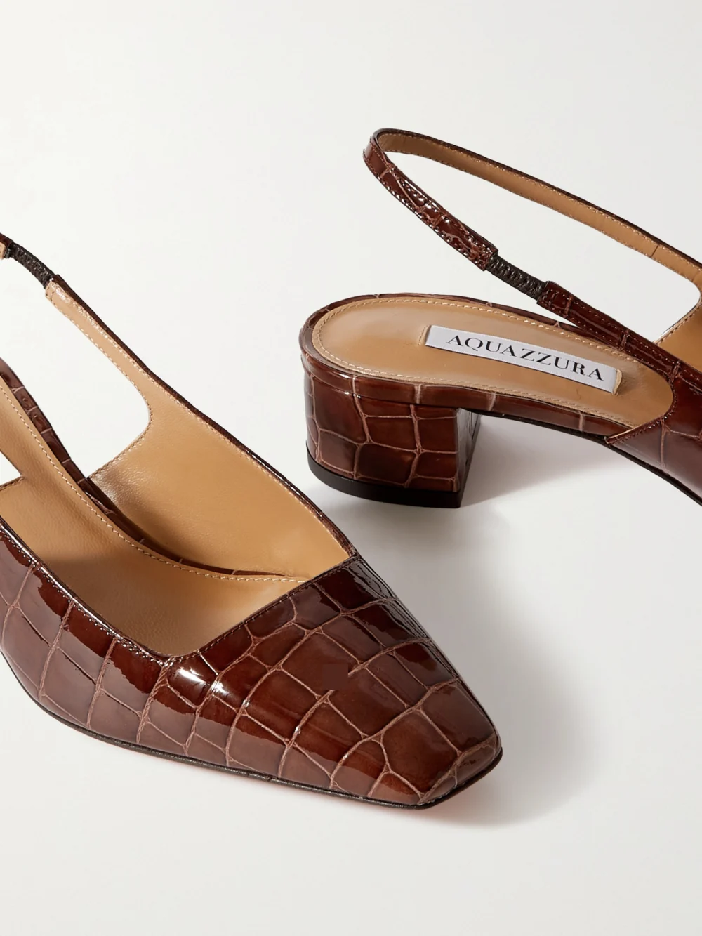 Close-up detail of the Aquazzura Ginza 35 Croc-effect Leather Slingback Pumps