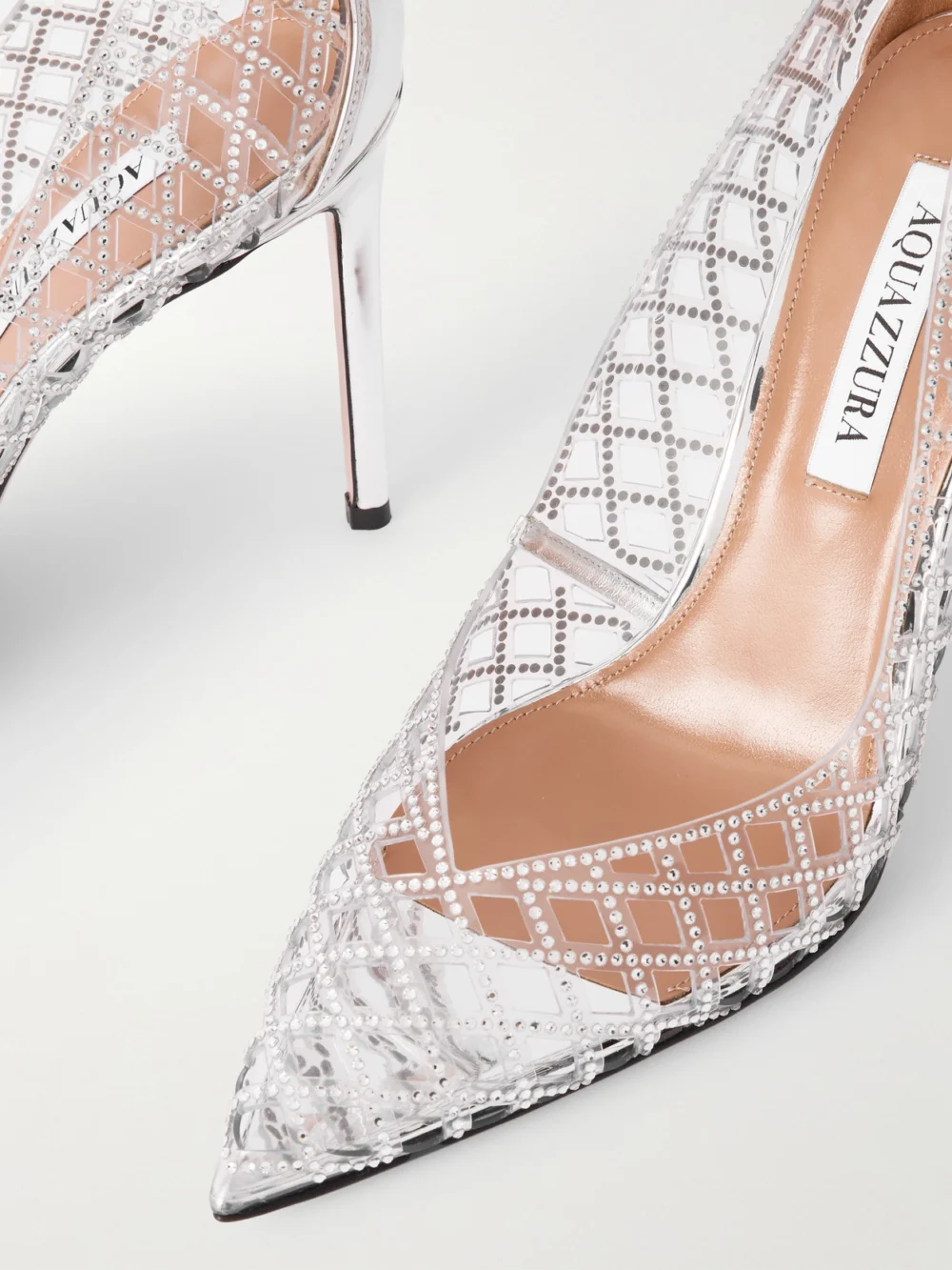 Close-up detail of the Aquazzura Lumiere 105 Metallic Leather-trimmed Crystal-embellished Cutout Pvc Pumps