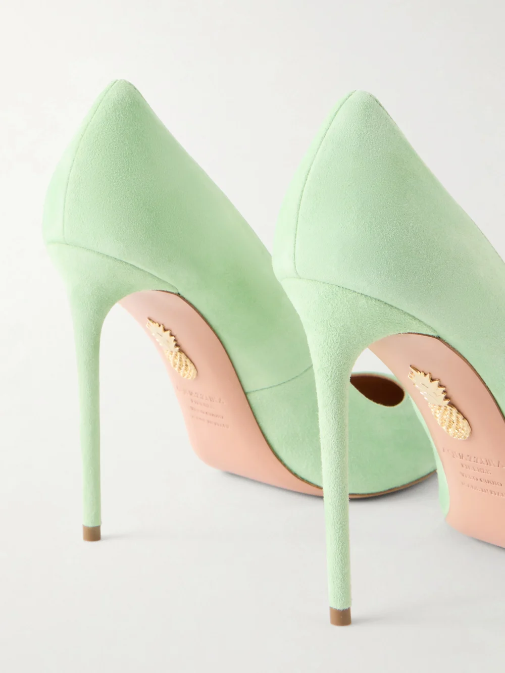 Close-up detail of the Aquazzura Purist 105 Suede Pumps
