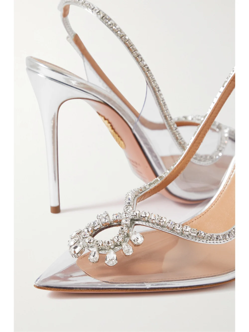 Close-up detail of the Aquazzura Seduction 105 Crystal-embellished Metallic Leather and Pvc Slingback Pumps