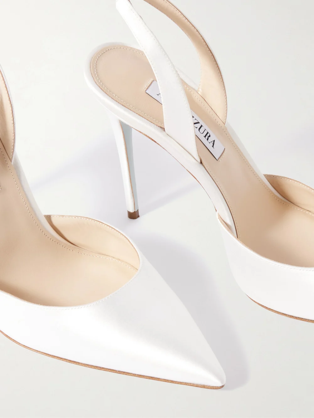 Close-up detail of the Aquazzura So Nude 105 Satin Slingback Pumps