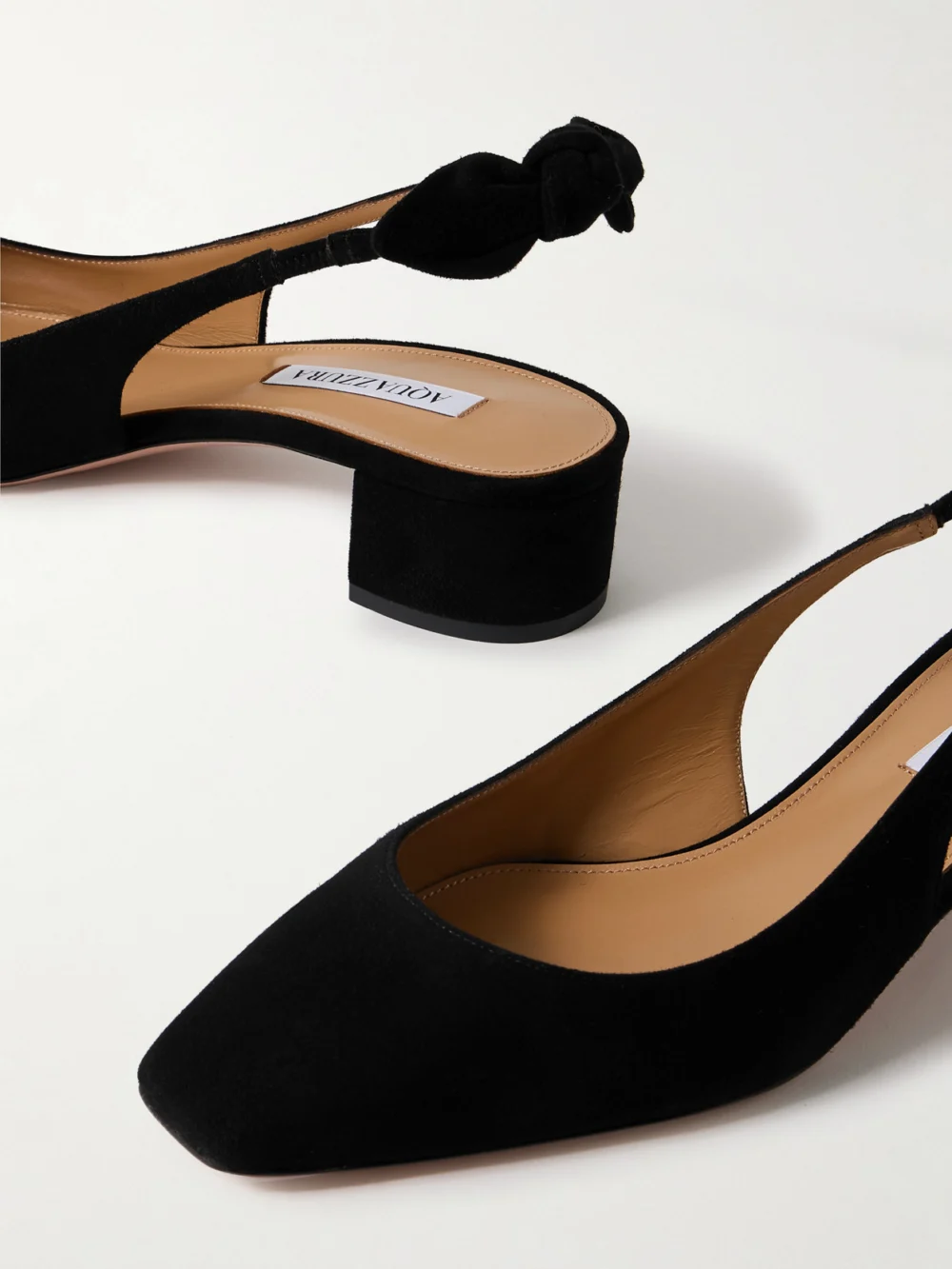 Close-up detail of the Aquazzura Very Bow 35 Suede Slingback Pumps
