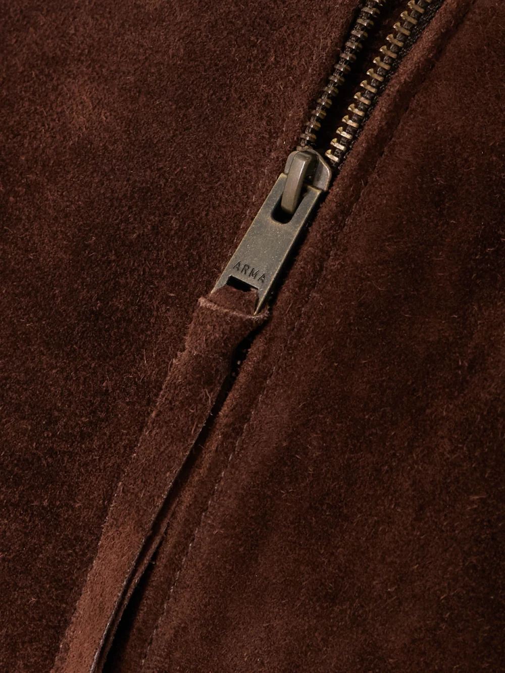 Close-up detail of the Arma Elettra Cropped Suede Bomber Jacket