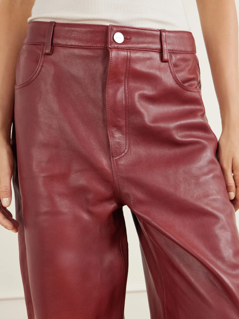 Close-up detail of the Arma Leather Wide-leg Pants