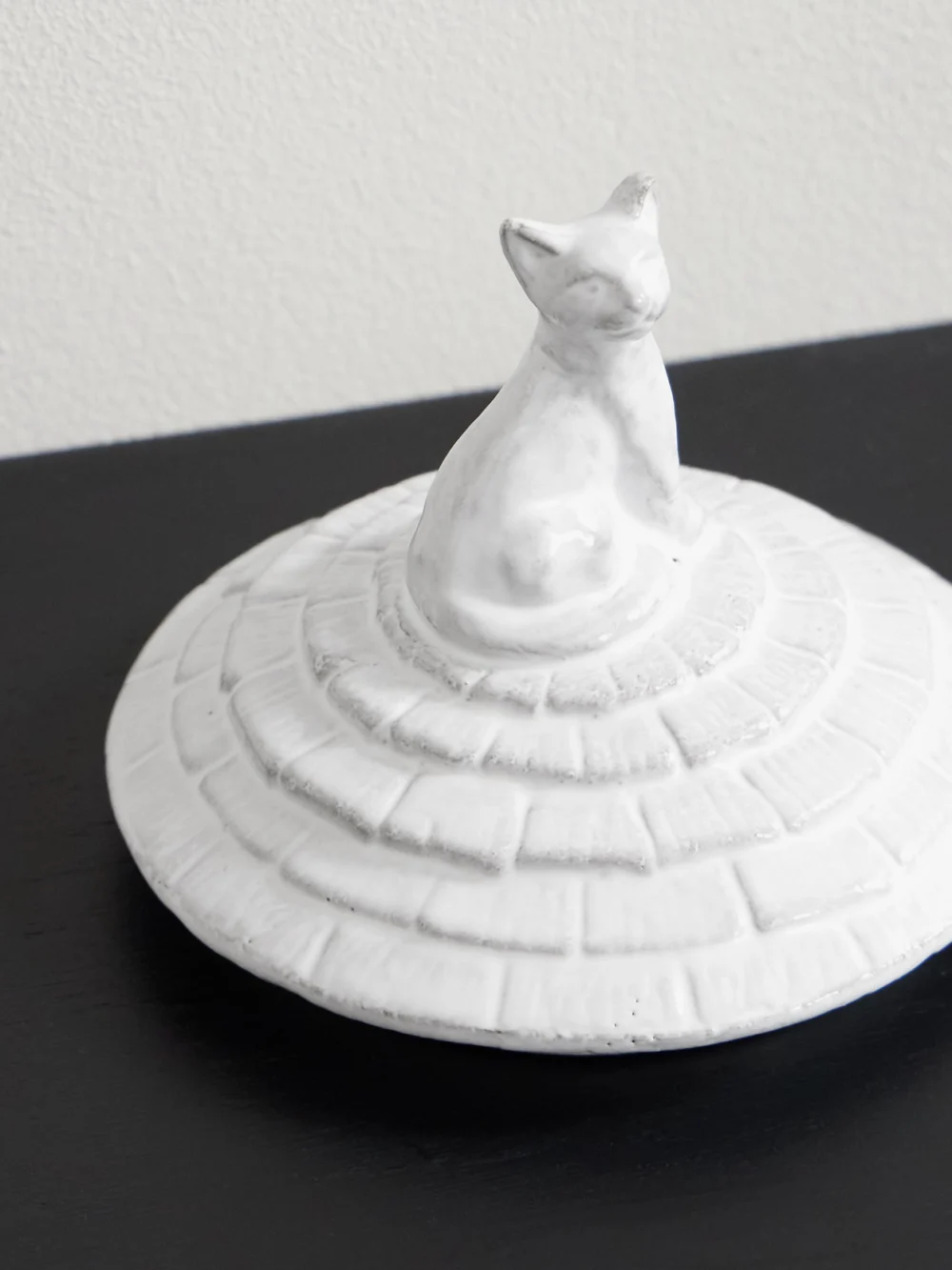 Close-up detail of the Astier De Villatte Grand Chalet Large Ceramic Candle Lid