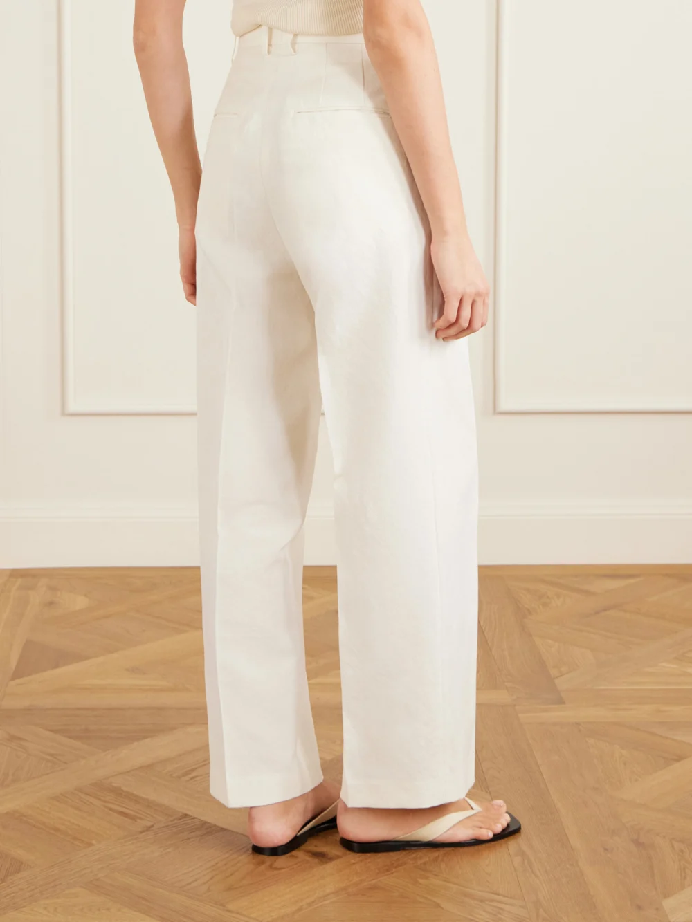 Back view of the Auralee Pleated Wool, Cotton and Linen-blend Oxford Wide-leg Pants