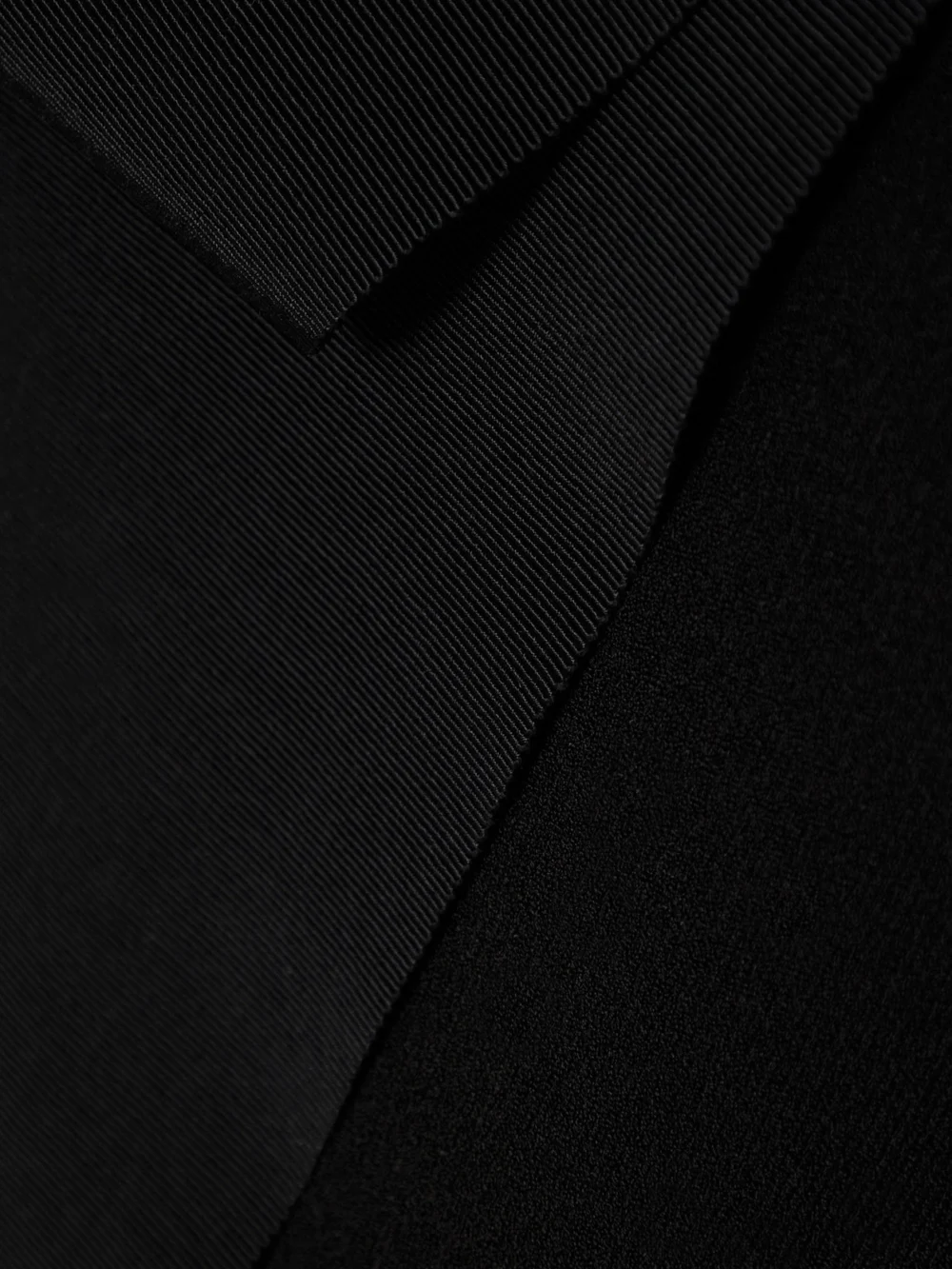 Close-up detail of the Az Factory Mybody One-shoulder Bow-detailed Stretch-knit Mini Dress
